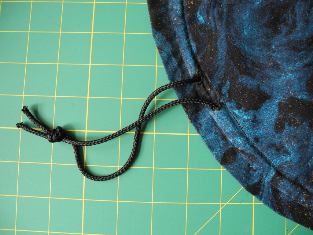 tied black drawstring for blue dice bag 