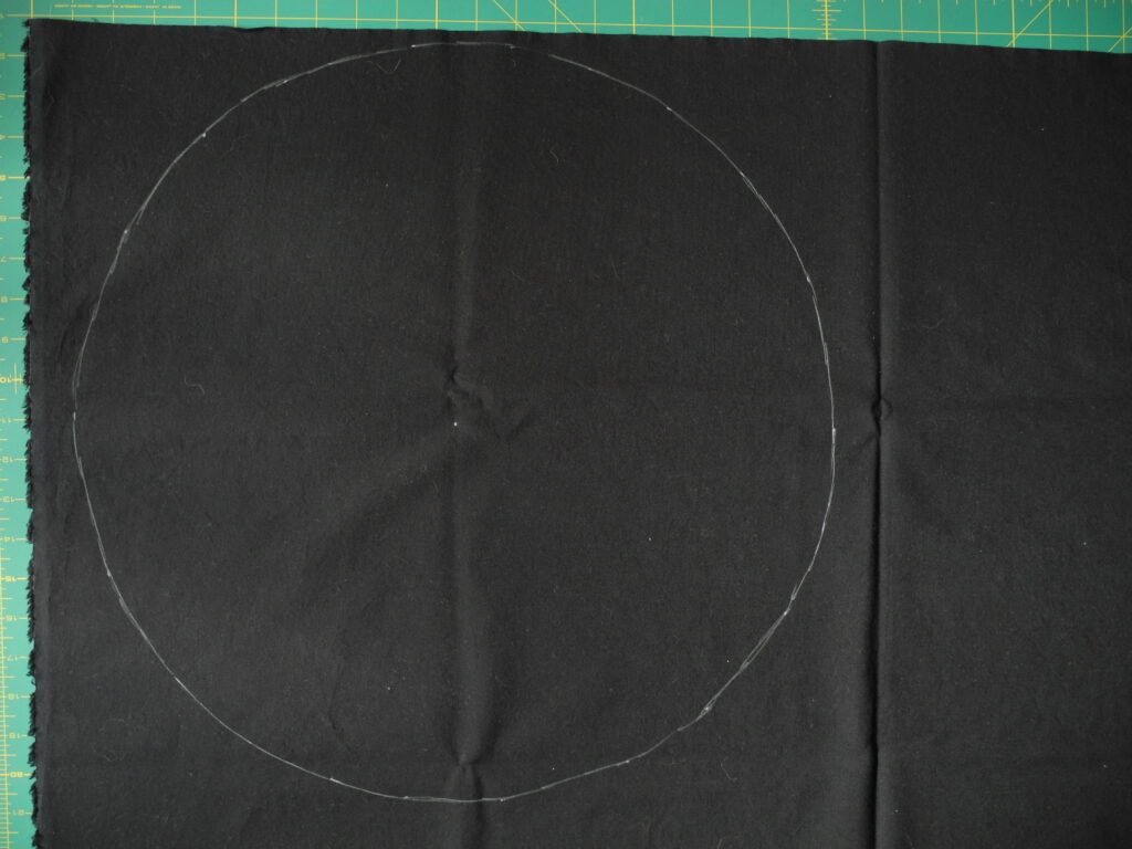 white chalk circle on black fabric