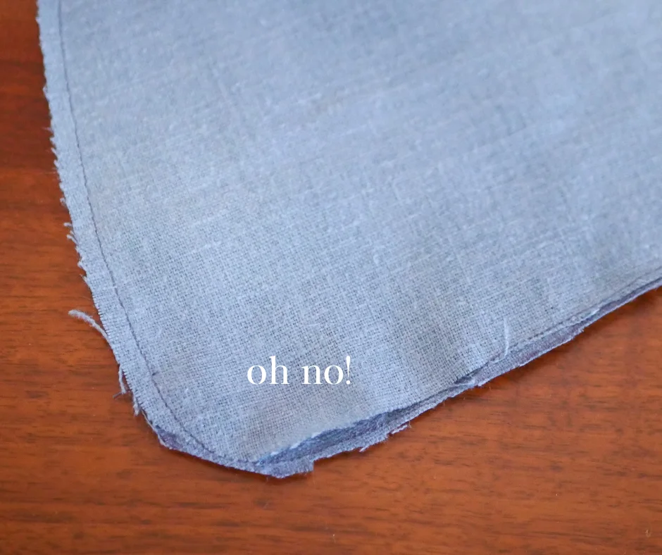 Image of the corner of a pocket with a hole in the bottom labeled oh no!