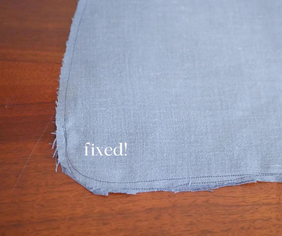 Image of the corner of a pocket in blue linen with the corner seam sewn twice to prevent a hole labeled fixed! 