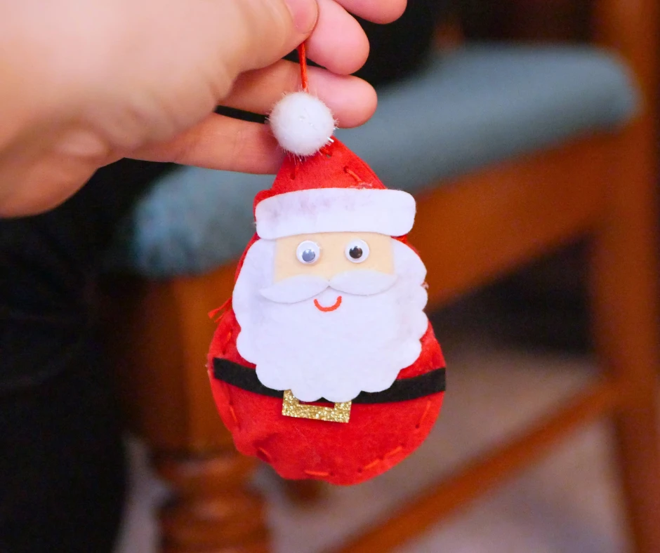 Image of a Santa ornament made of felt. 