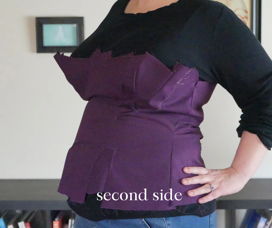 Image of the left side of a purple corset mockup. The bust is better placed, and the gores are closer to the waist. Image is labeled, "second side."